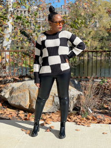 woman black/cream checkered pattern sweater