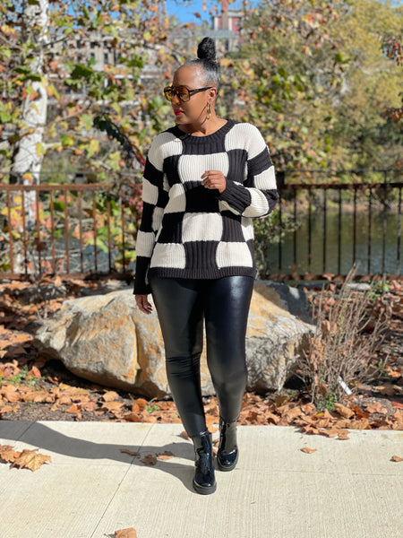 woman black/cream checkered pattern sweater